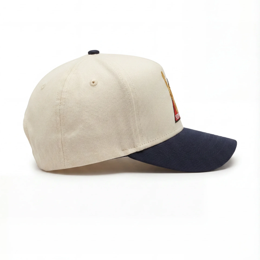 Statue of Liberty NYC bronze hat — cream and navy New York baseball cap, full view