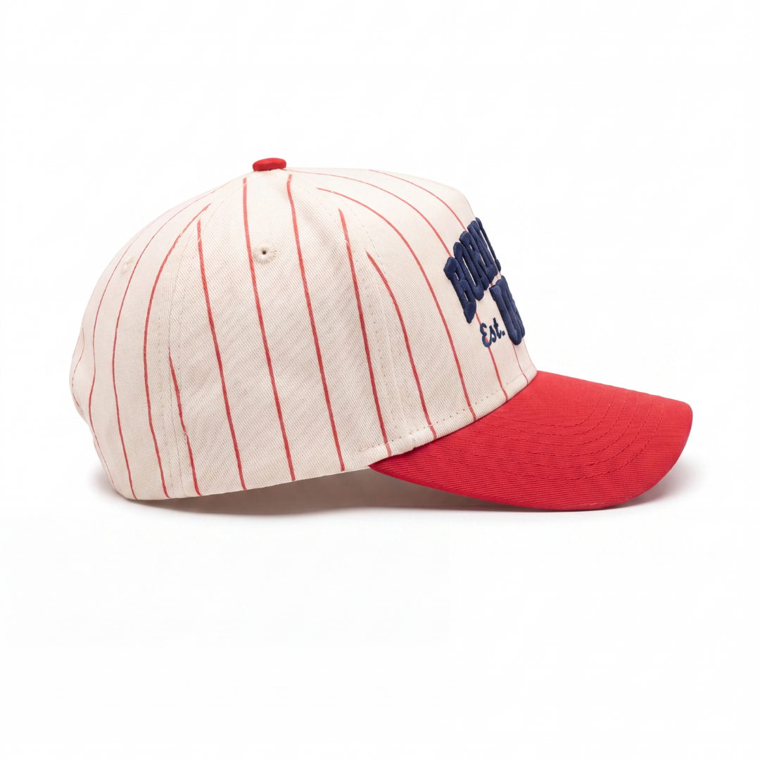 Born in the USA hat back — red curved brim and adjustable strap-back closure