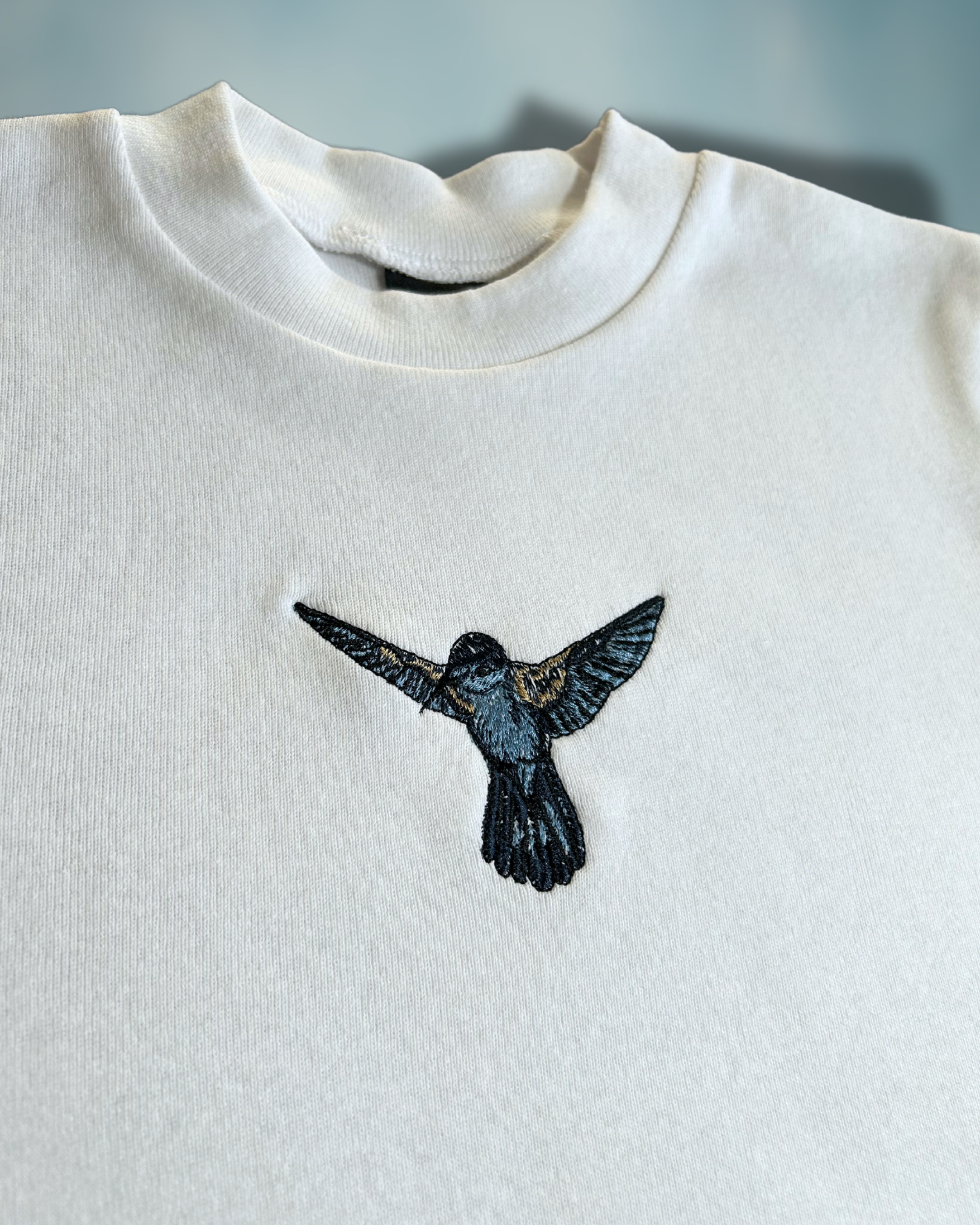 Hummingbird Sky Baby Tee – Embroidered Blue Hummingbird