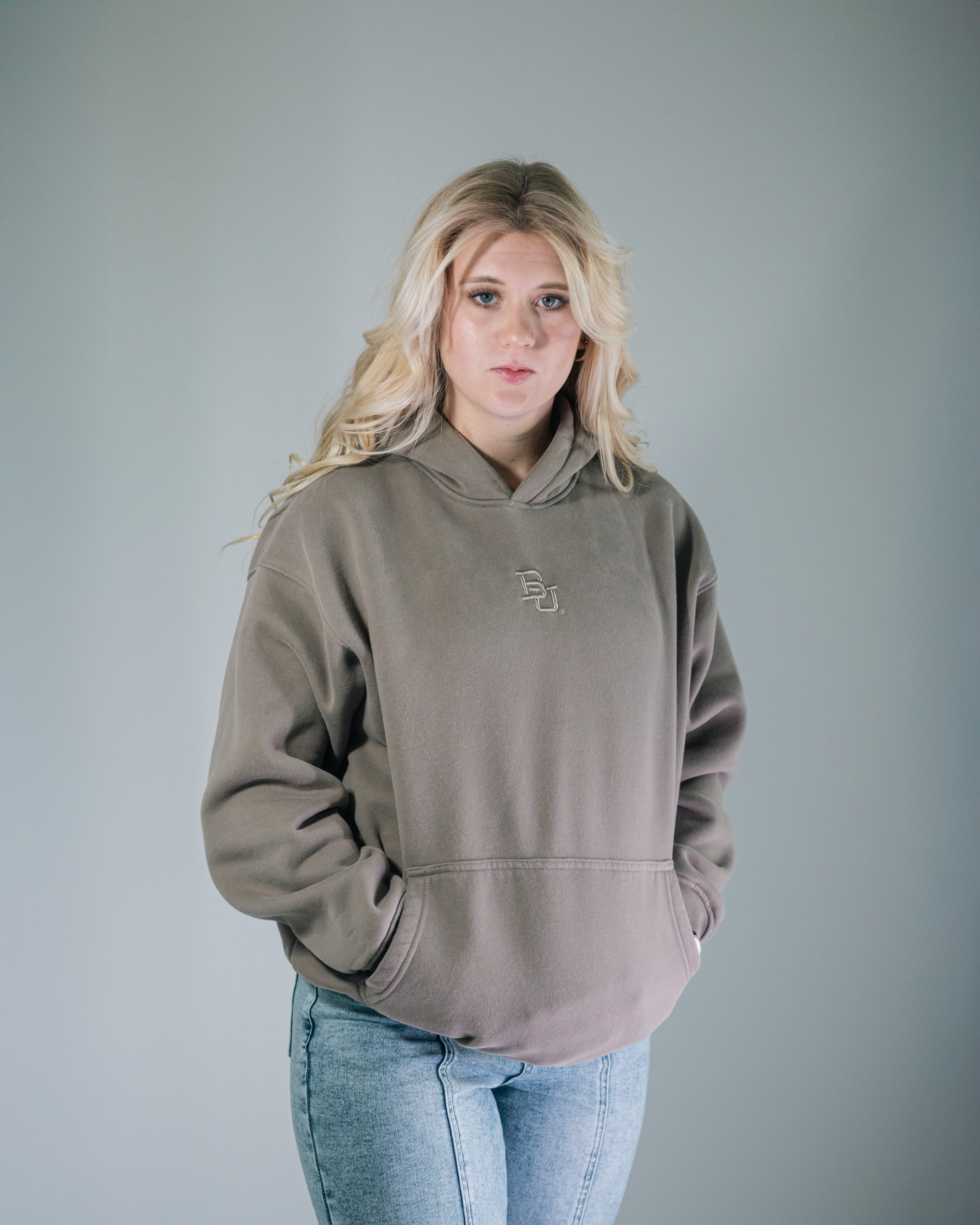 blonde female model wearing baylor university mclane stadium hoodie