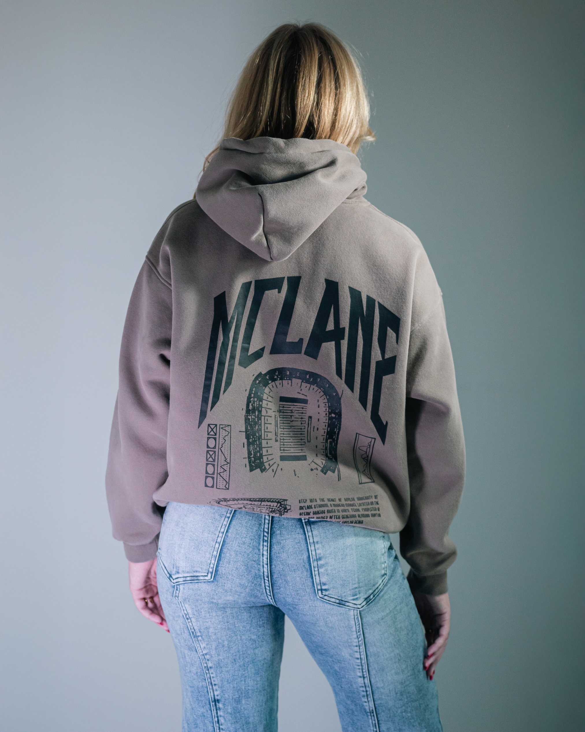 blonde female model wearing baylor university mclane stadium hoodie