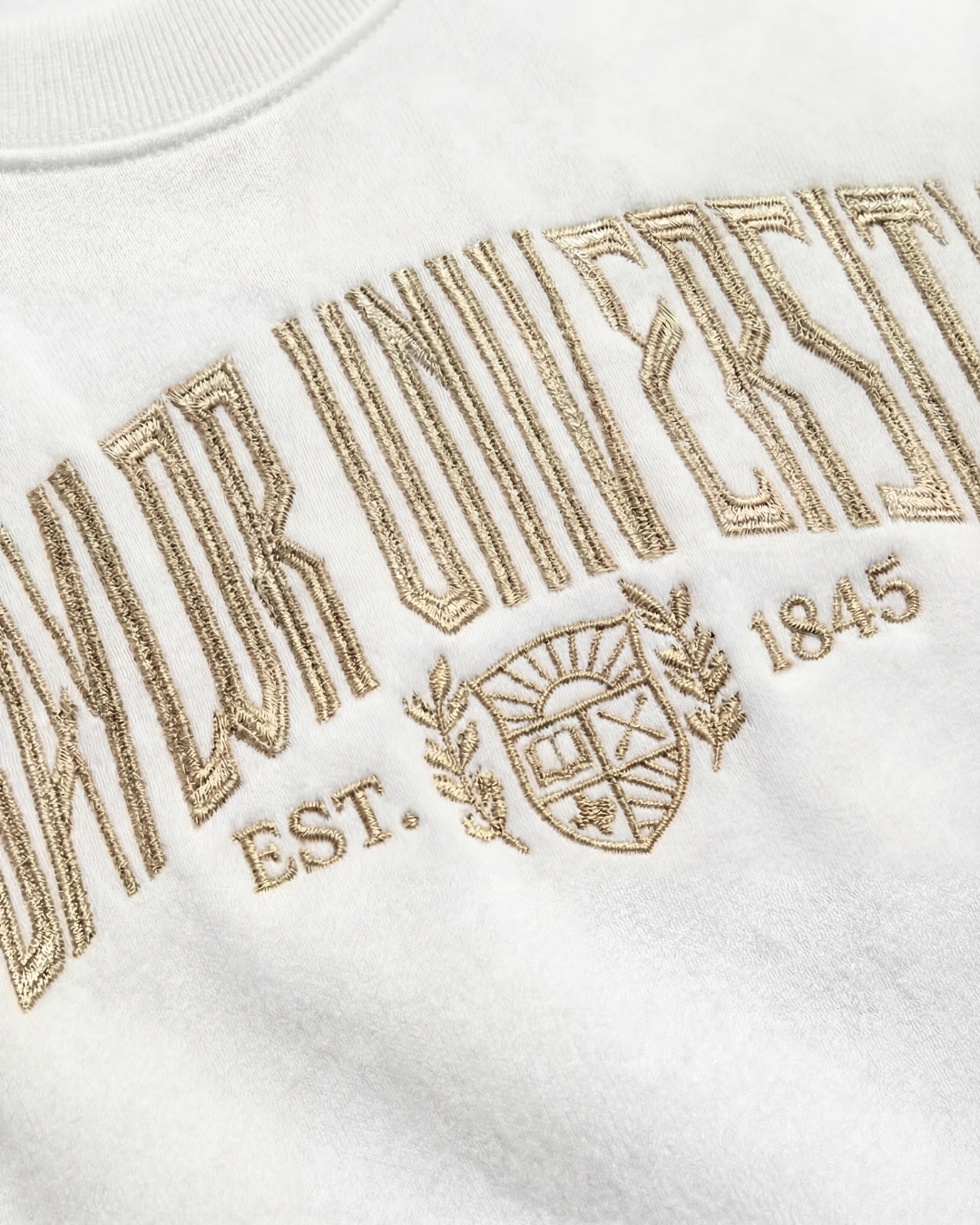 Embroidered Baylor logo on white vintage crewneck sweatshirt