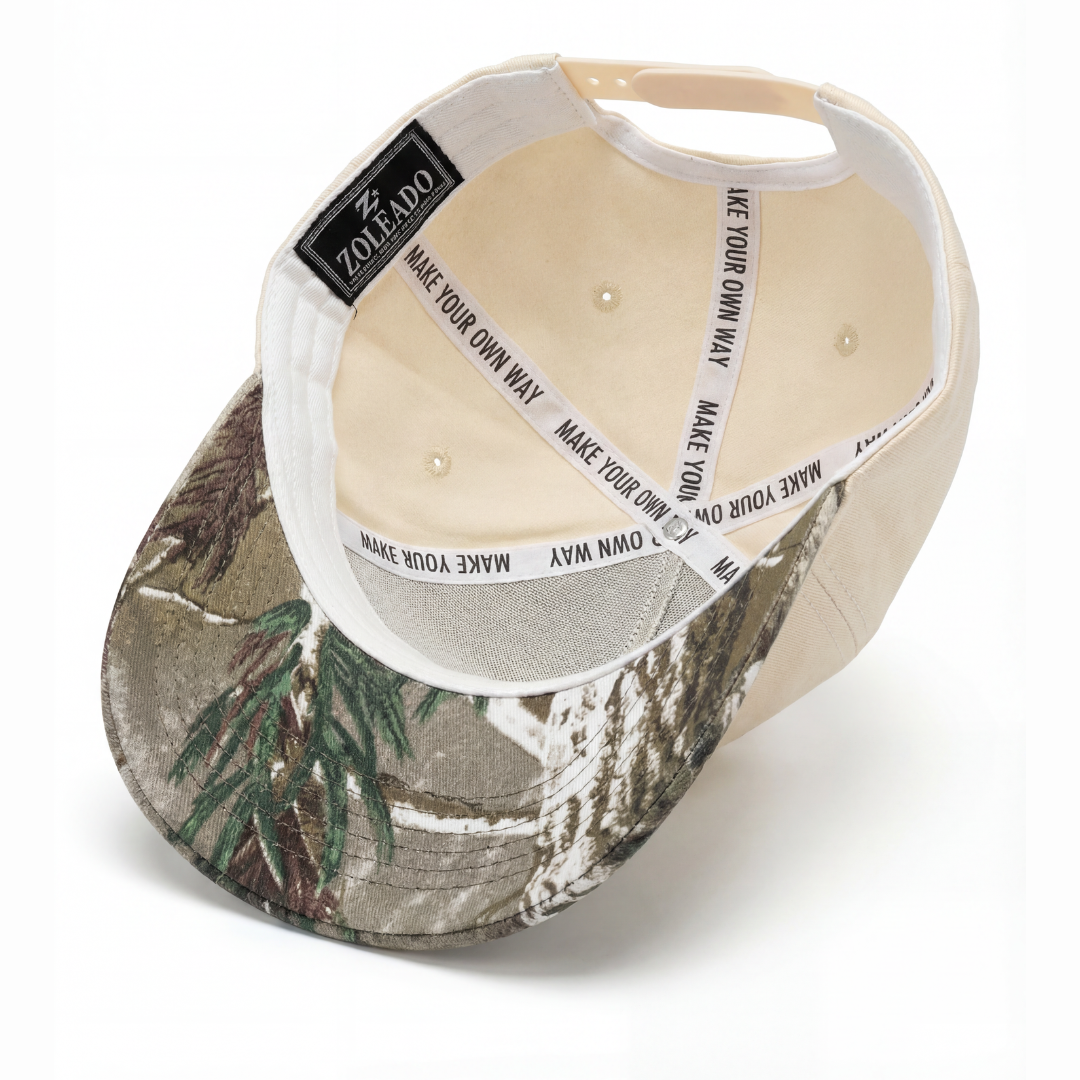 Baylor Bears Texas camo hat detail — close-up of 3D embroidered BAYLOR lettering on cream twill