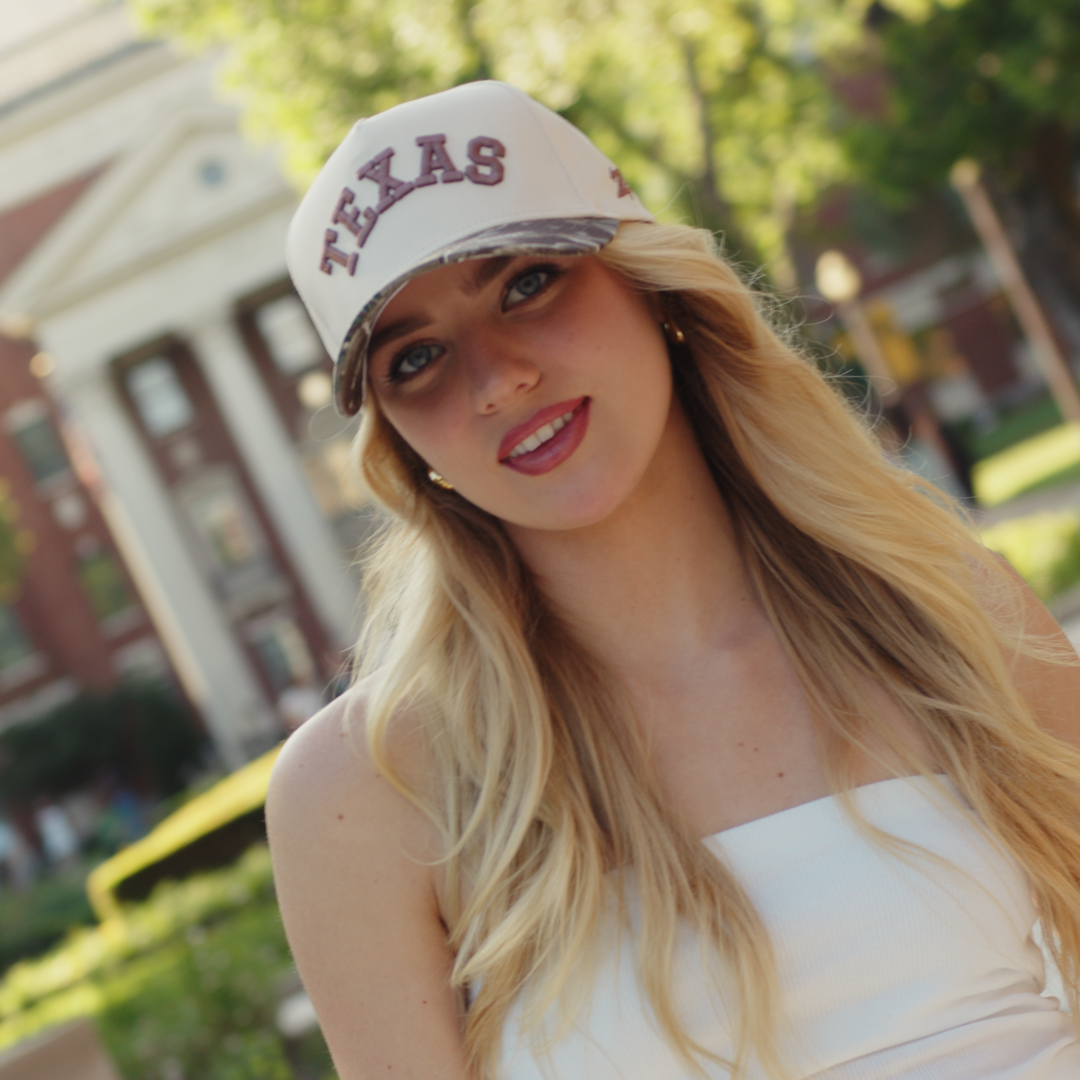 Texas camo hat lifestyle shot showing woodland camo brim paired with a casual outfit