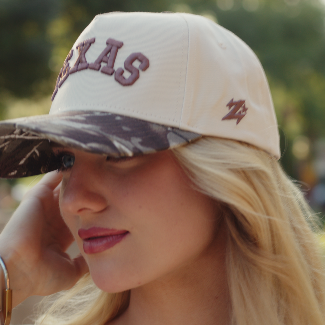 Texas camo Lone Star hat styled for game day with cream crown and camo brim