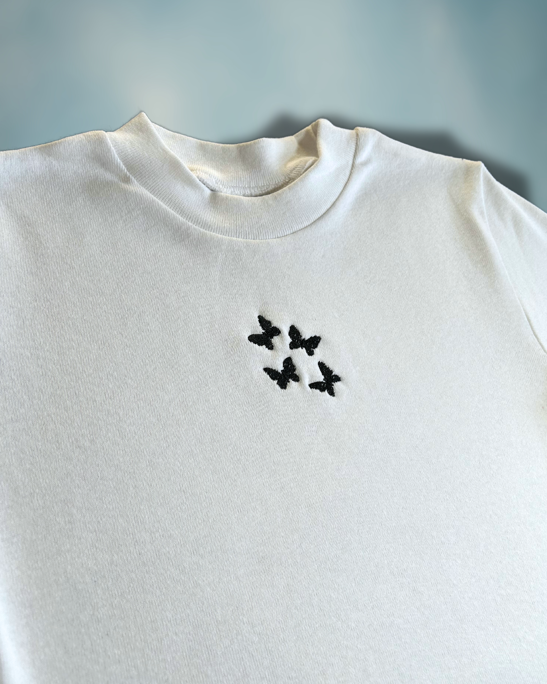 Midnight Flutter Baby Tee – Embroidered Black Butterflies