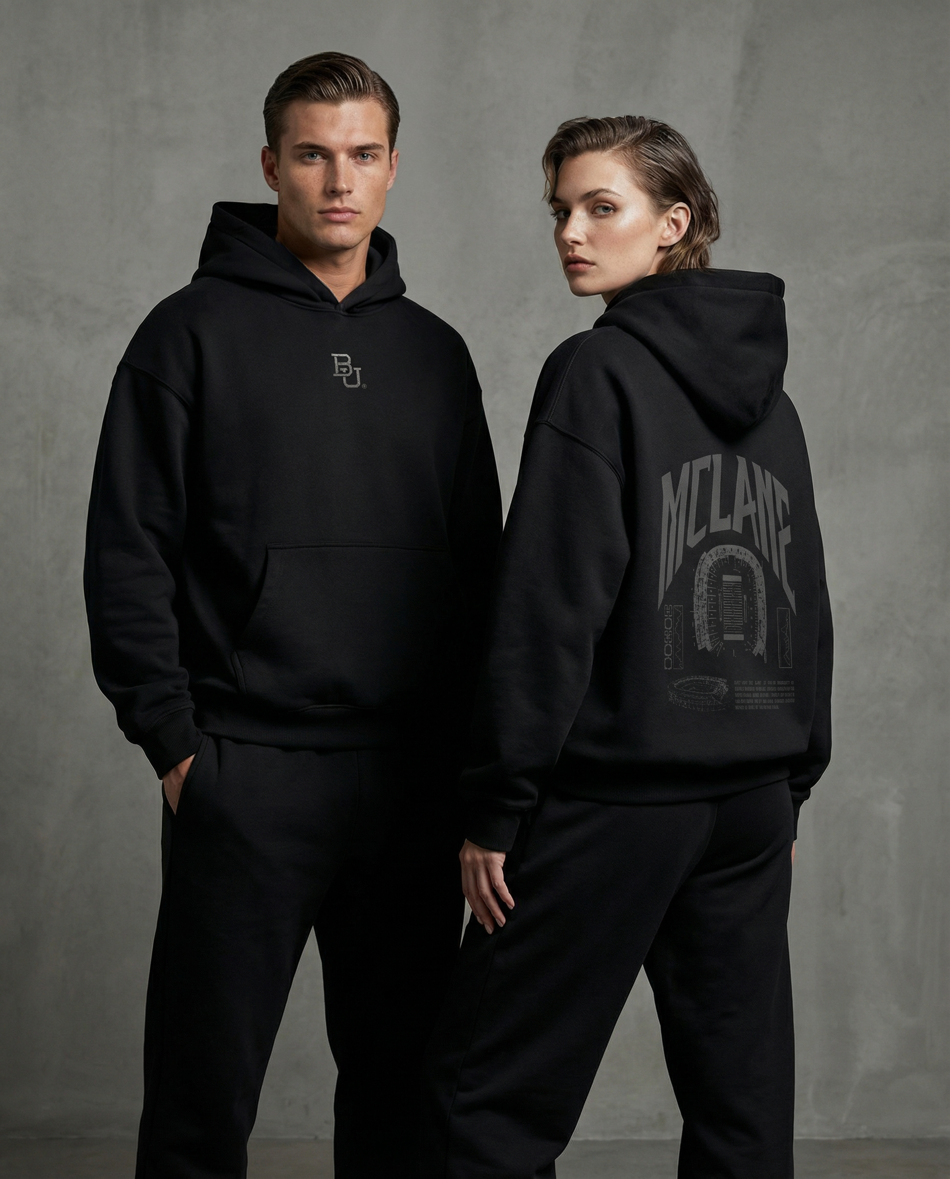 Two people wearing black Baylor University hoodies with visible McLane branding against a gray background