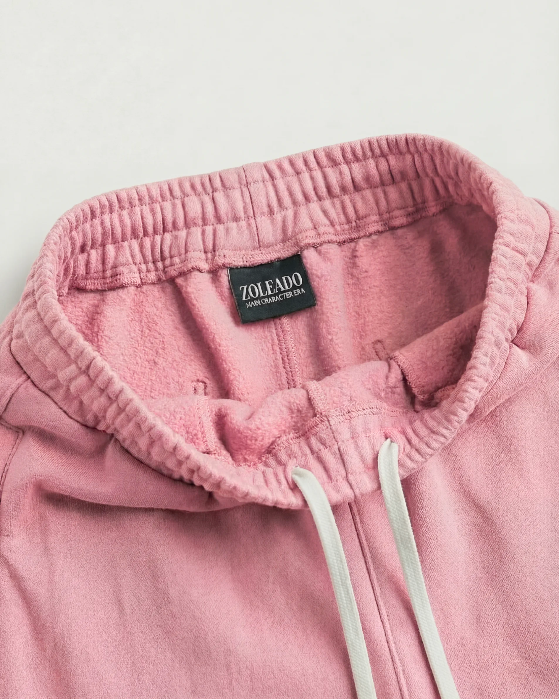 Pink acid wash wide-leg sweatpants, relaxed boxy fit, zoleado tag, inside angle