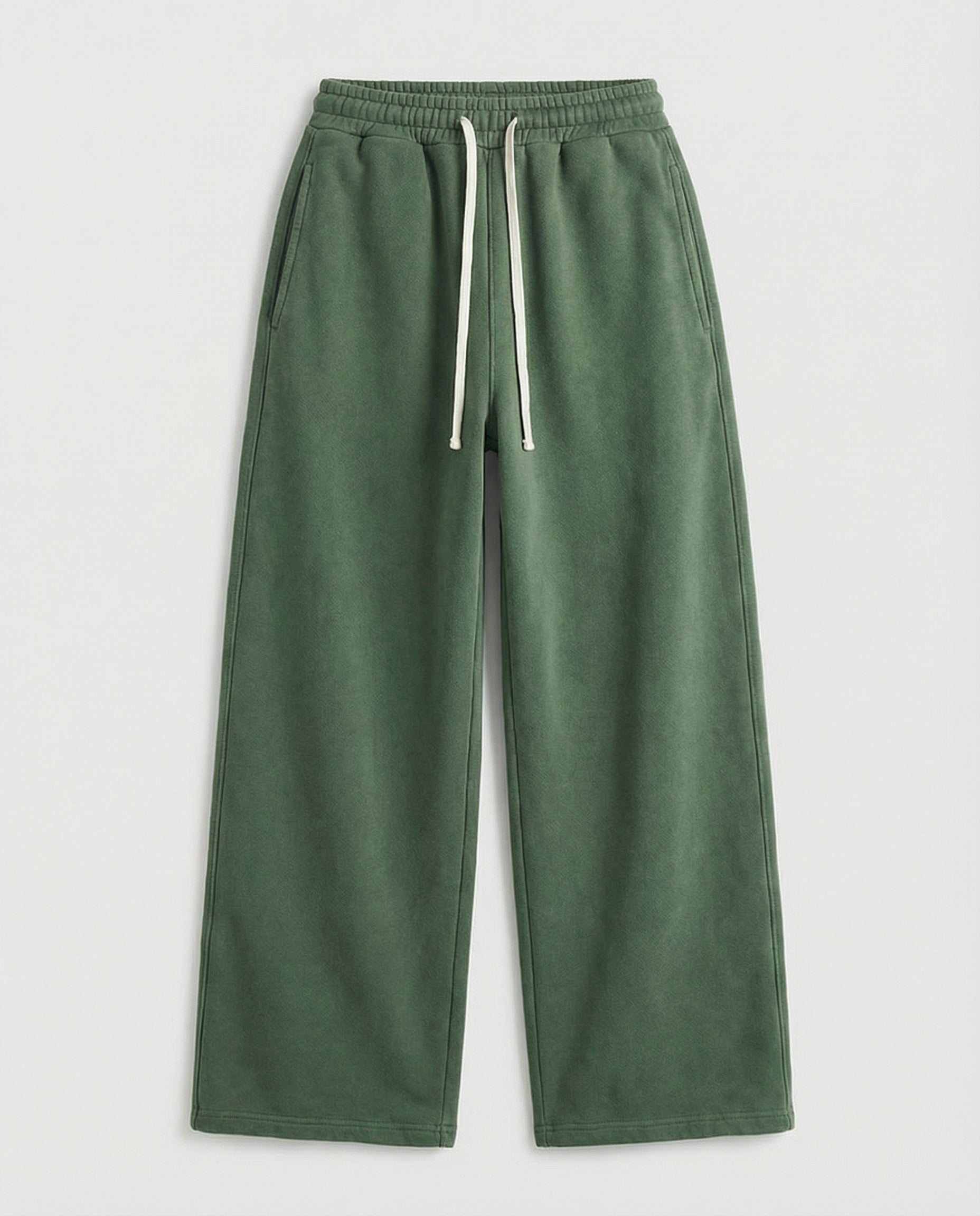 Body green washed sweatpants with a drawstring on a light gray background