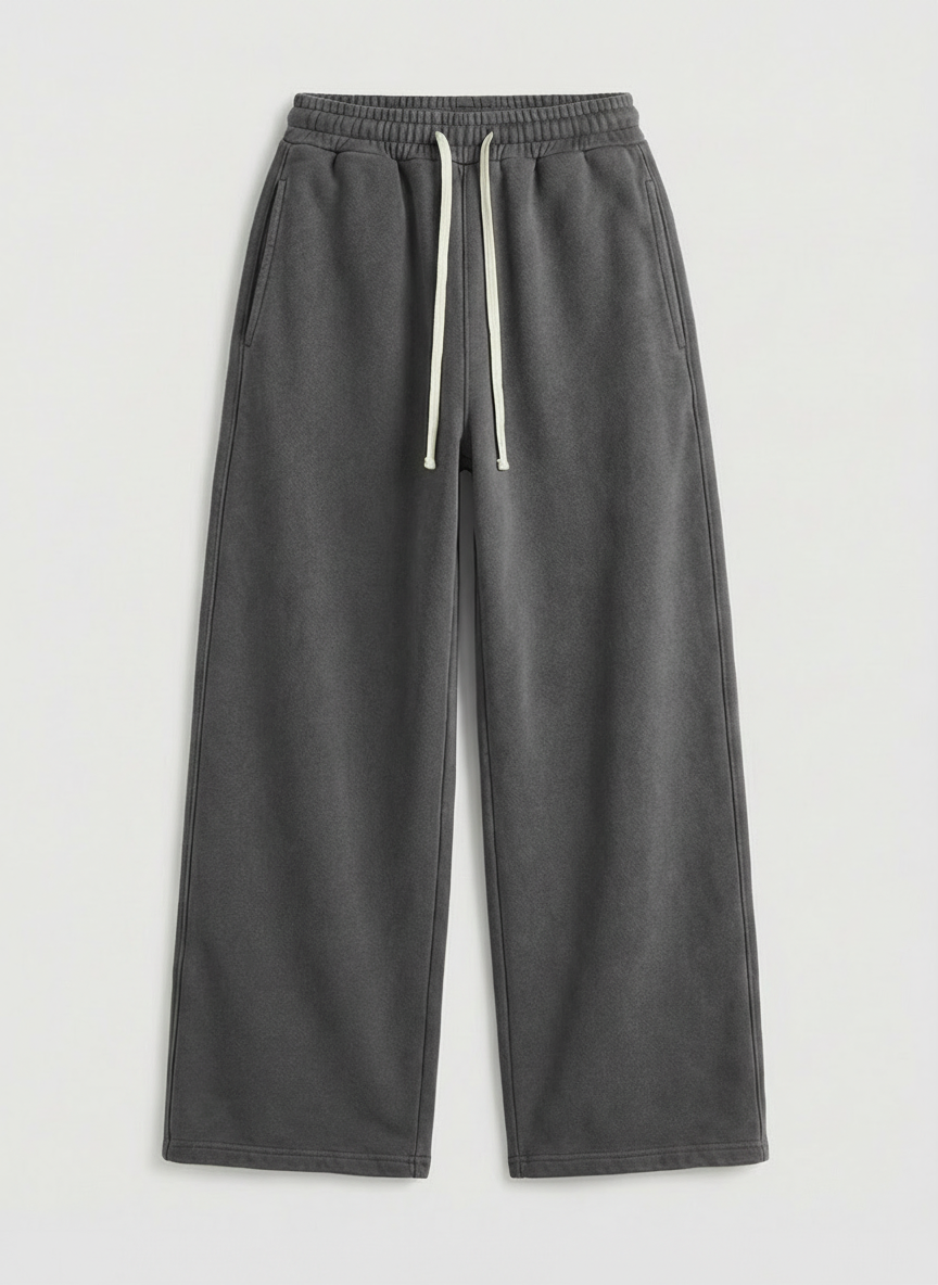 Gray washed sweatpants with a white drawstring on a light gray background