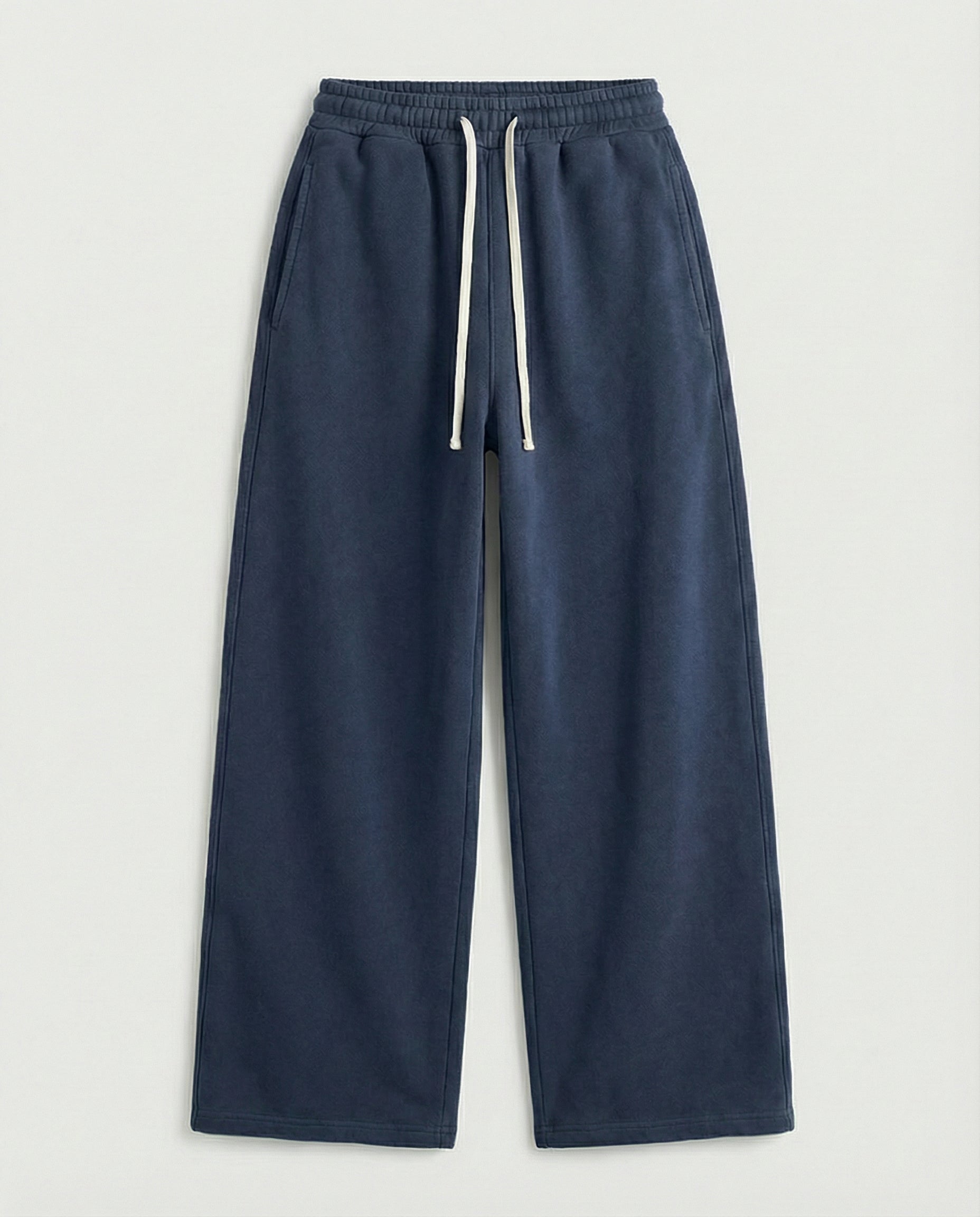 Navy blue sweatpants with a drawstring on a light gray background
