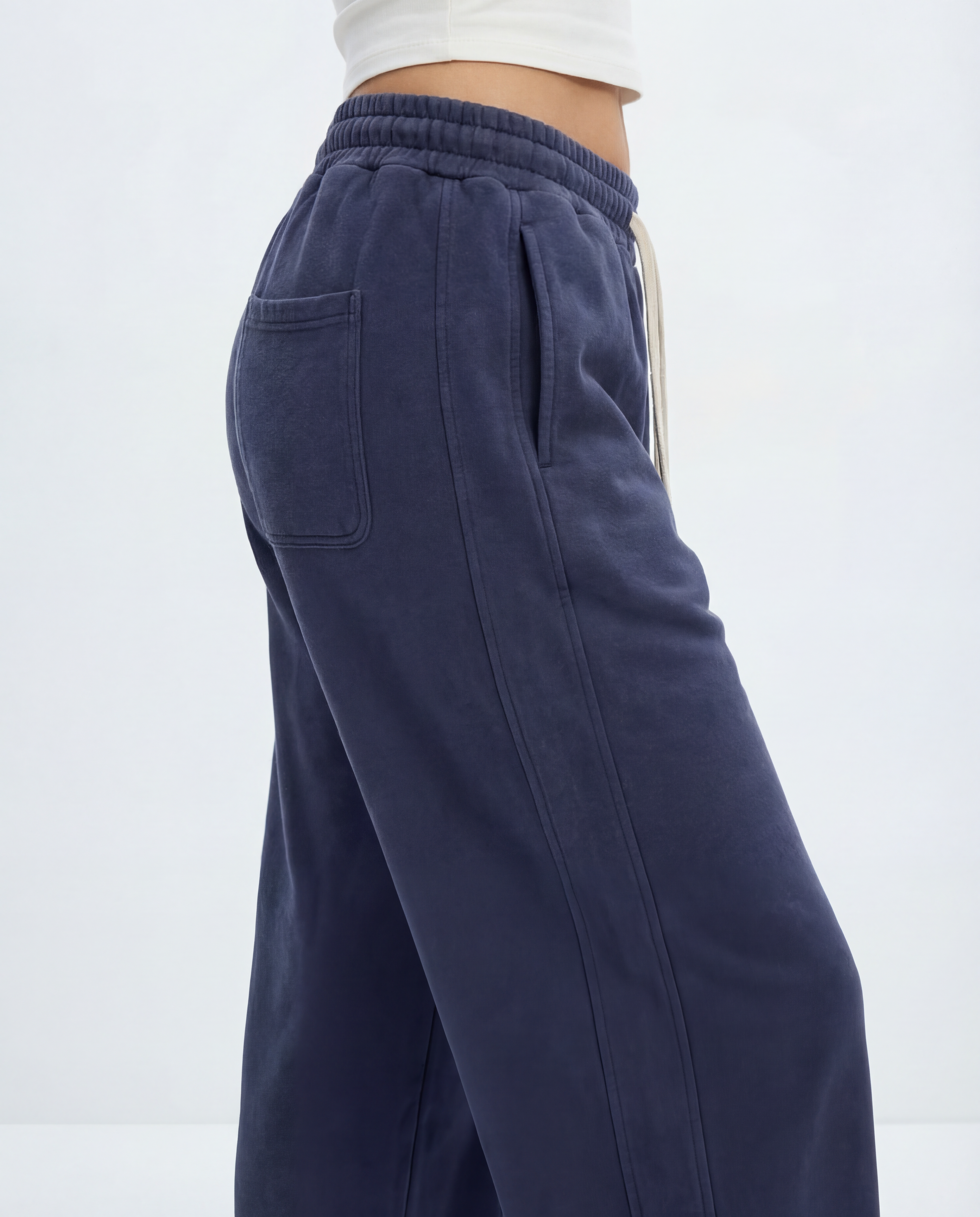Navy blue pants with a white background