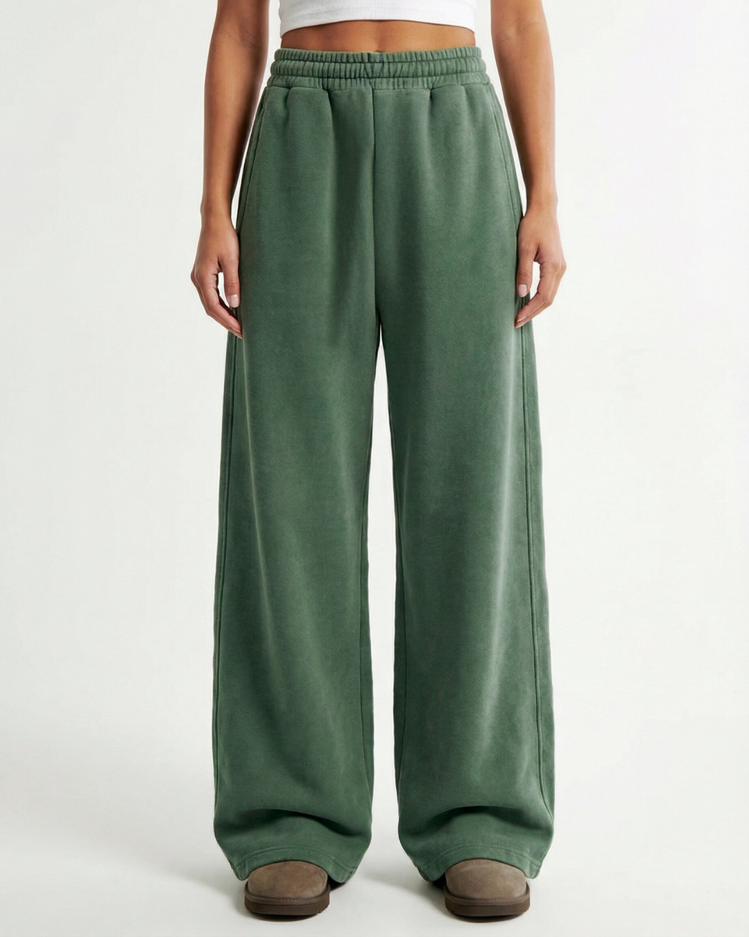 Green wide-leg acid green wash pants worn by a person on a white background