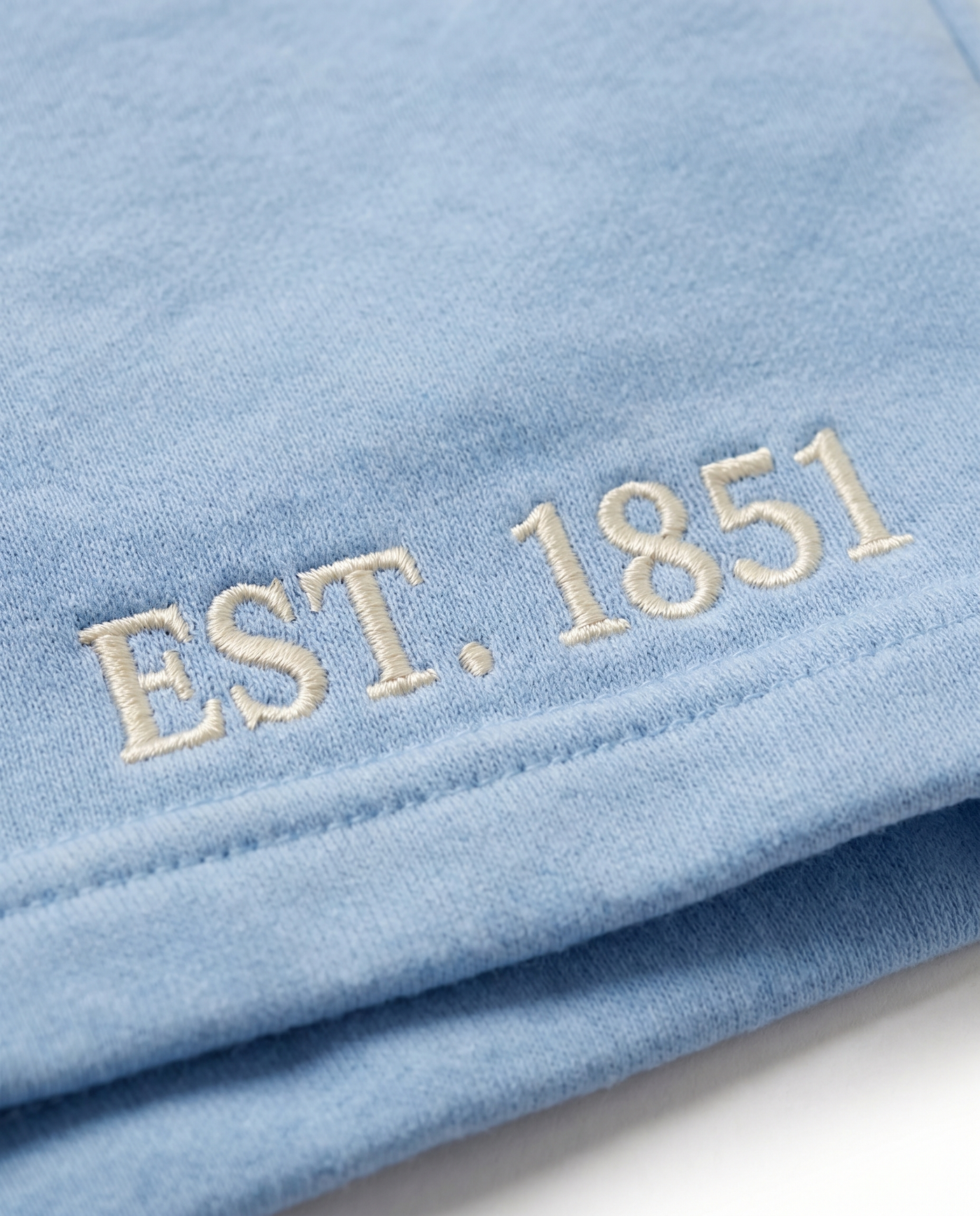 Alpha Delta Pi Shorts EST. 1851 leg embroidery close-up on powder azure cotton fleece